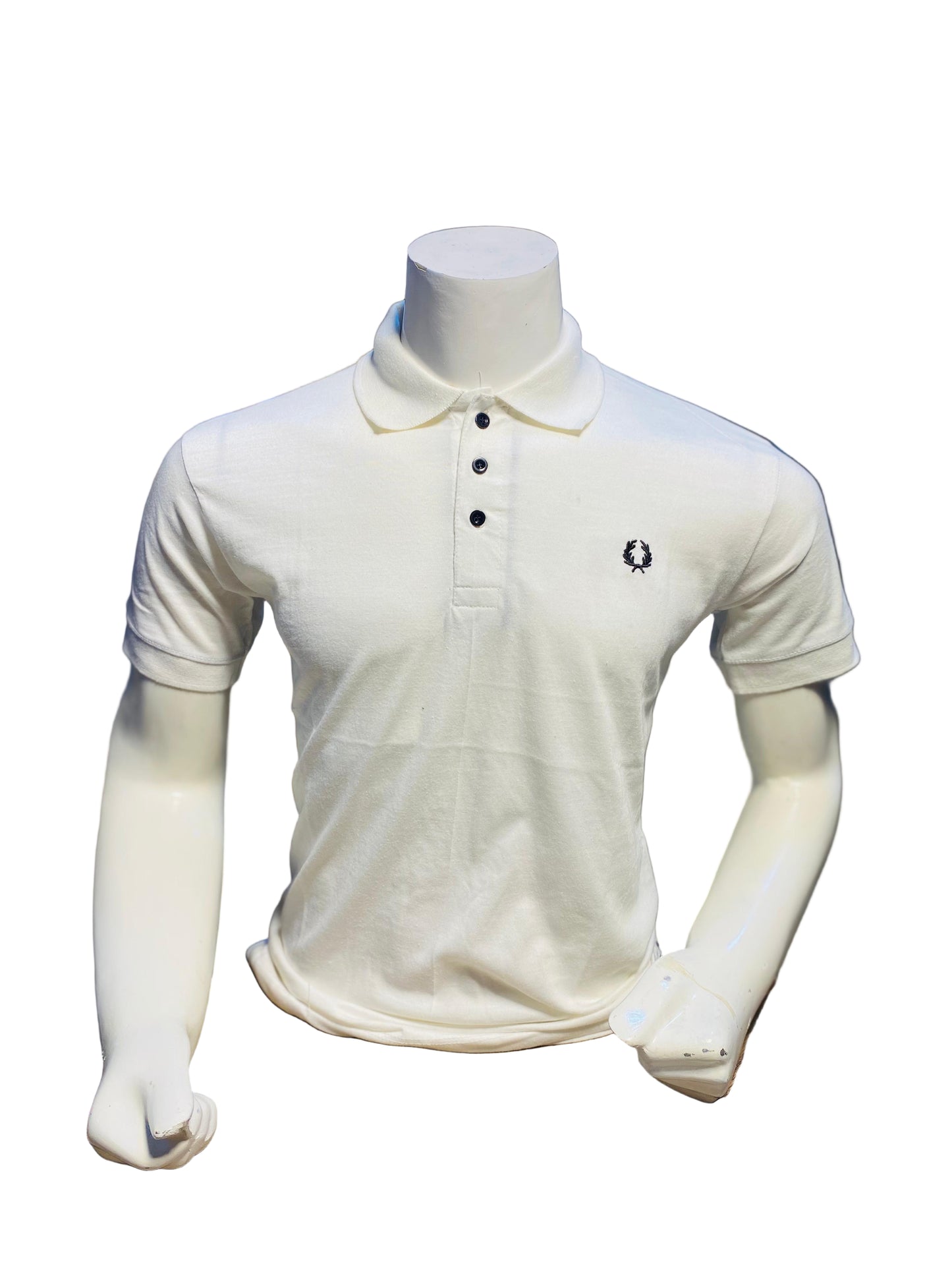 White polo shirt on a mannequin in a store setting