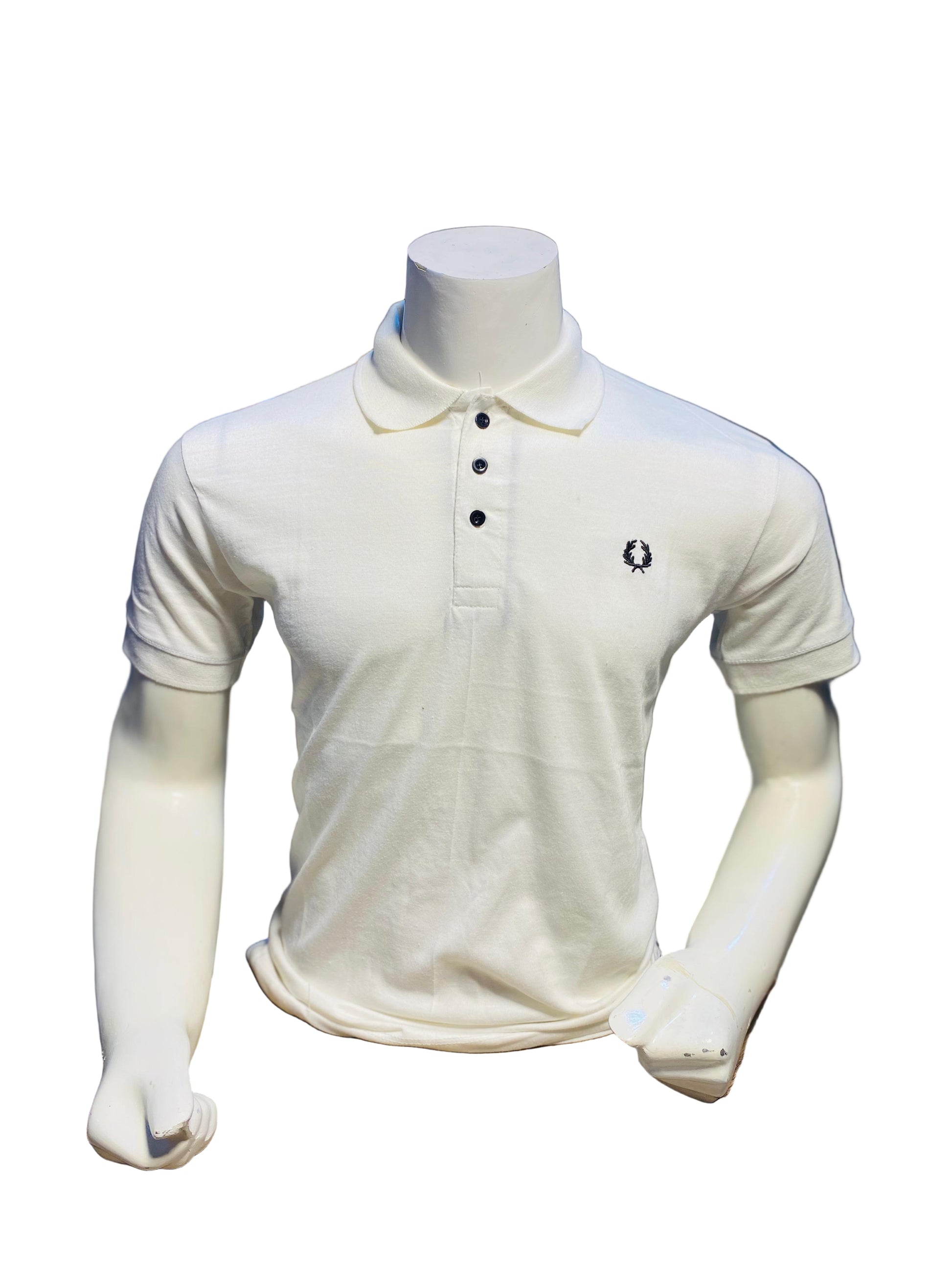 White polo shirt on a mannequin in a store setting